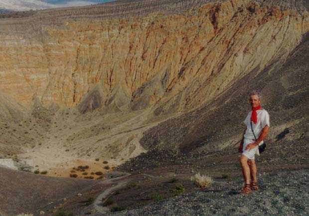 Closeup of Centurio Marcus standing at the edge of the impressive Ubenebe Crater.